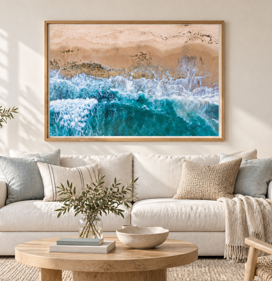 Thirteenth Beach wall art displayed in a wooden frame above a sofa
